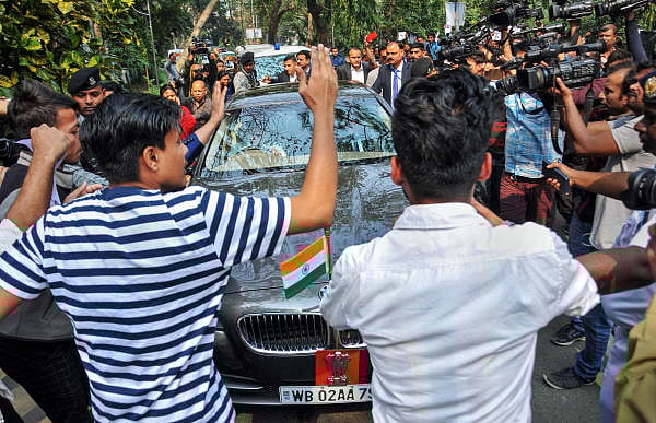 Students of various colleges and universities stage a protest in front of West Bengal Governor Jagdeep Dhankhar's car on his arrival at the Calcutta University to attend its annual convocation ceremony, in Kolkata, Tuesday, Jan. 28, 2020. (PTI Photo)