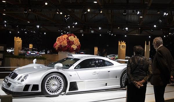 A couple view the Mercedes CLK GT R as part of the Dream Cars display during the Brussels Auto Show at the Expo in Brussels, Thursday, Jan. 9, 2020. (AP/PTI Photo)