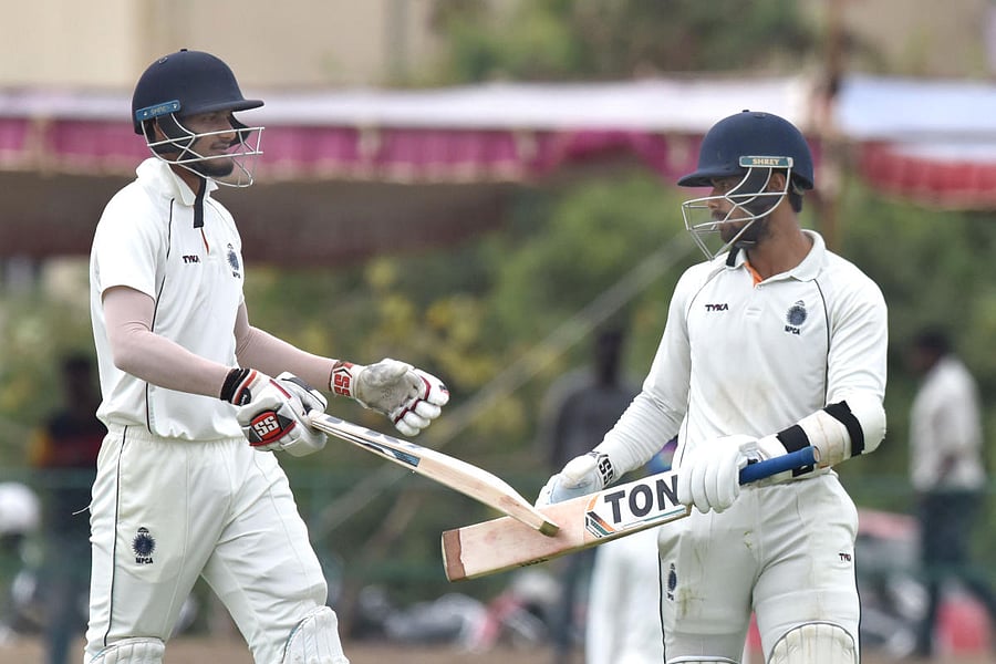 Madhya Pradesh's Aditya Srivtsava (right) and Kuldeep Sen celebrate after taking the first innings lead against Karnataka with a brilliant 50-run 10th-wicket stand on Friday. DH PHOTO/ SK DINESH