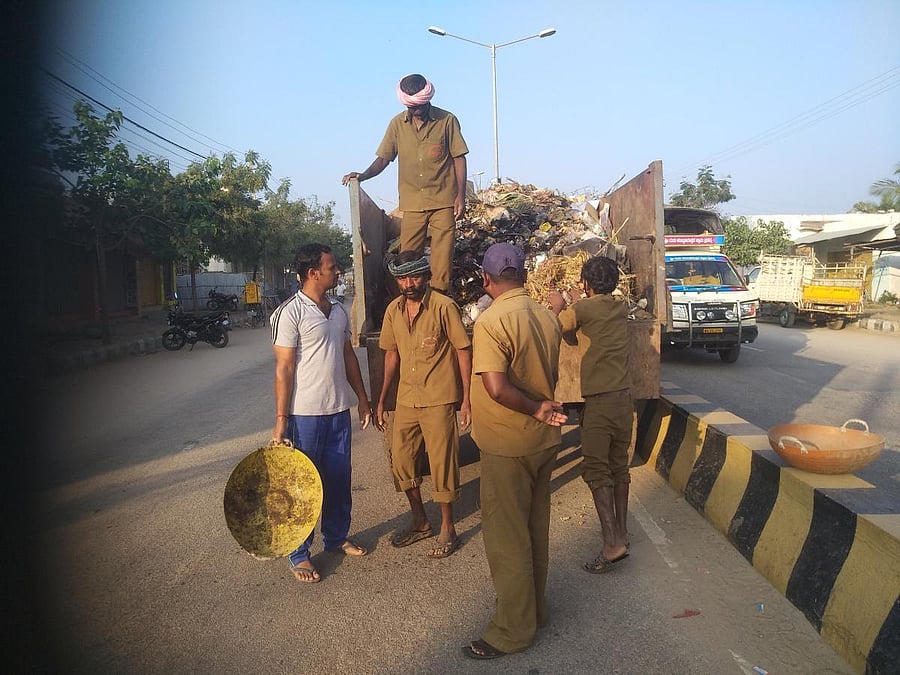 Nagaraj, a PE teacher, helps pourakarmikas clean Kotturu’s streets every morning for an hour.