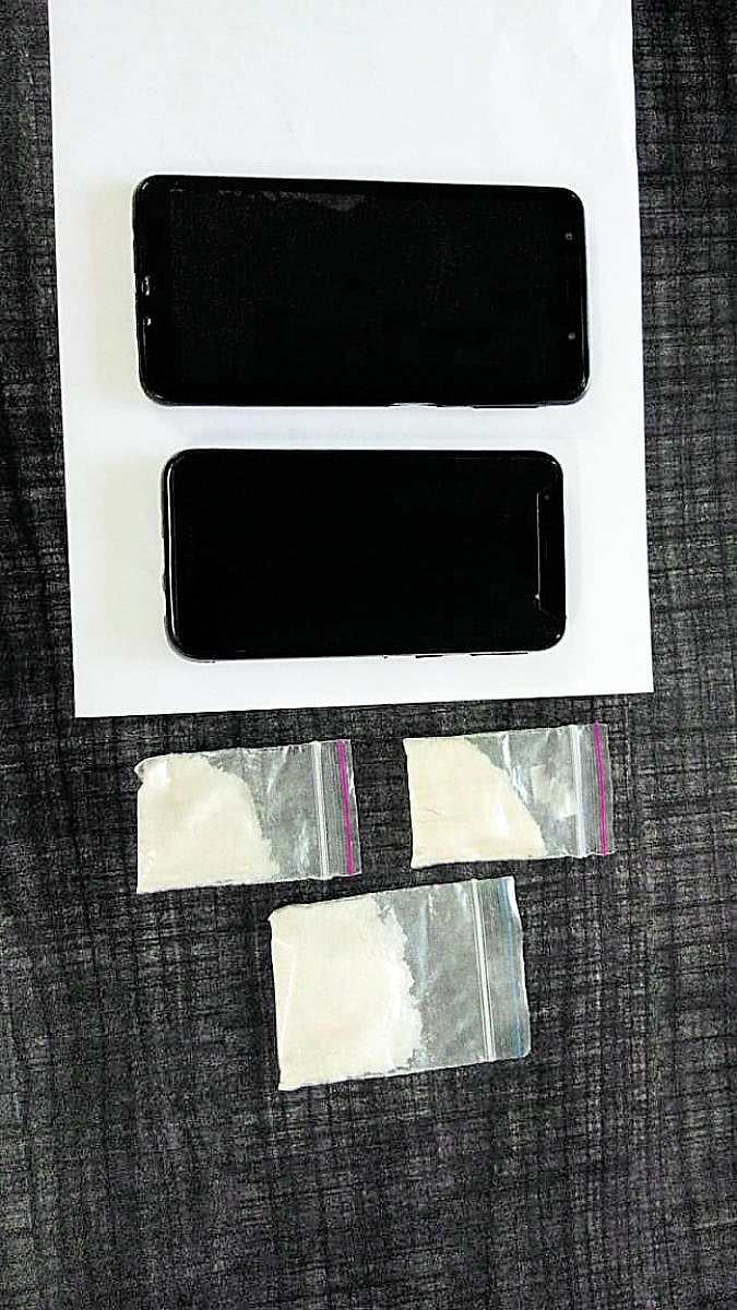 The illict drugs and mobile phones that were seized from the arrested.
