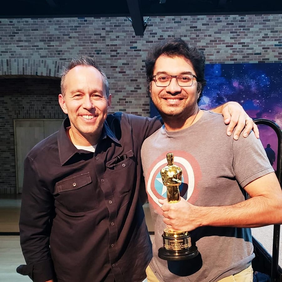 Amit Badkar (holding Oscar) with Jonas Rivera, the co-producer of Toy Story 4.
