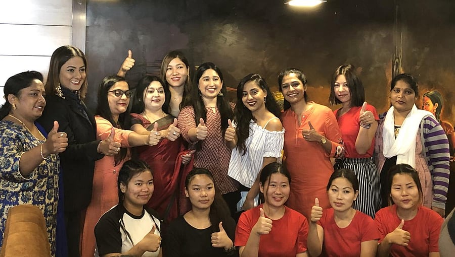 Panjury V Shankar, (fifth from right, standing), founder of Ms & Mrs with her team.