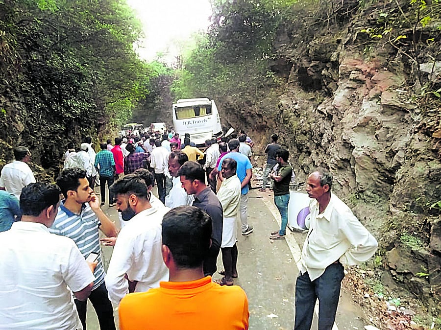 People gather at the accident spot near Mala check post in Karkala taluk on Saturday.