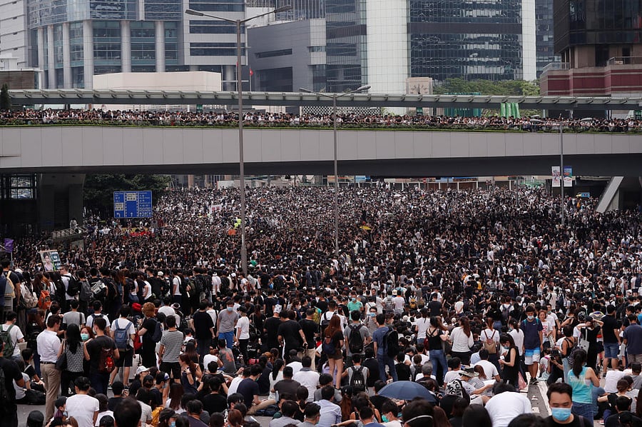 Protesters occupy a road during a demonstration against a proposed extradition bill in Hong Kong, China June 12, 2019. REUTERS/Tyrone Siu