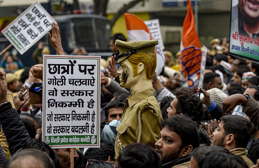  DPCC workers stage a demonstration over the alleged police action against the students of Jamia Millia Islamia University. (PTI Photo)