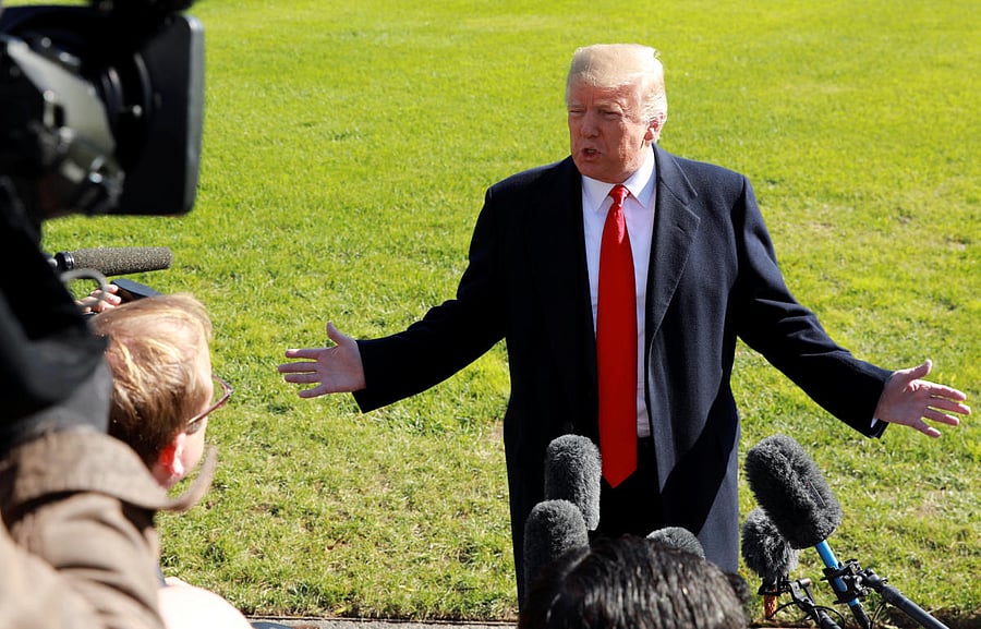 U.S. President Donald Trump speaks to reporters prior to departing on a trip to Houston from the White House in Washington, U.S., October 22, 2018. REUTERS/Kevin Lamarque