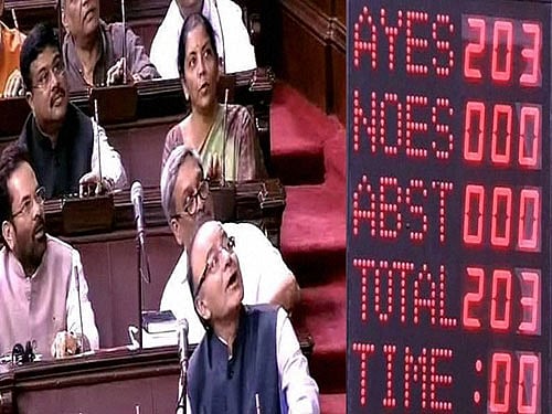 Finance Minister Arun Jaitley and BJP members during the voting on the GST Bill in the Rajya Sabha in New Delhi on Wednesday. PTI Photo