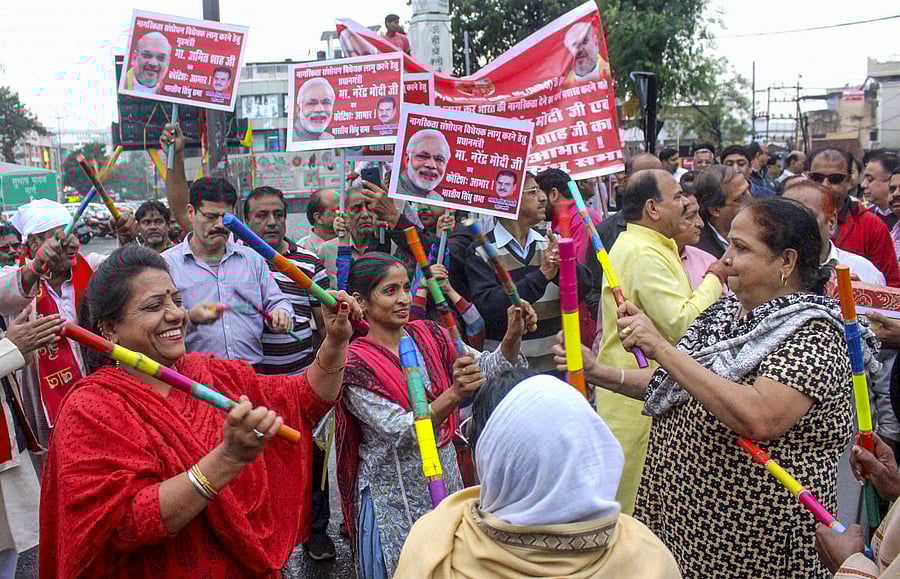 Members of Sindhi community celebrate the passsing of Citizenship Amendment Bill (CAB). (PTI Photo)