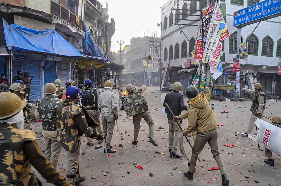 Police personnel clash with protestors during a rally against the Citizenship Amendment Act (CAA). (PTI Photo)
