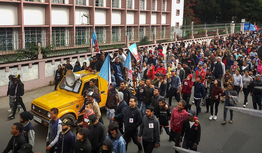 Protestors take part in a march against the passing of Citizenship Amendment Bill, infront of Raj Bhavan in Shillong. (PTI Photo)
