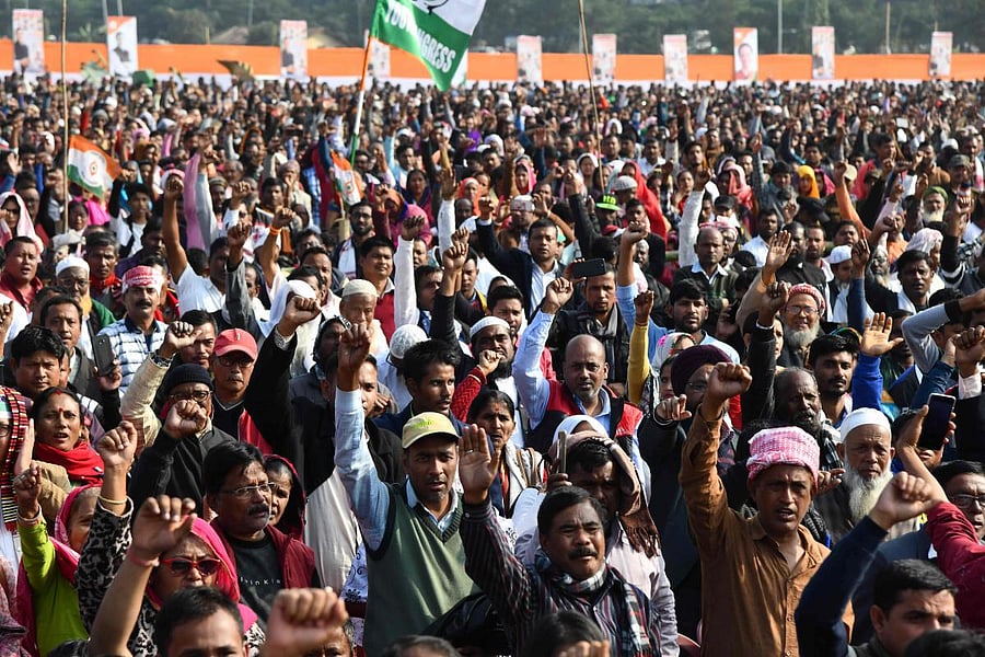 Congress Party activists and supporters shout slogans during a rally against India's new citizenship law, in Guwahati. AFP