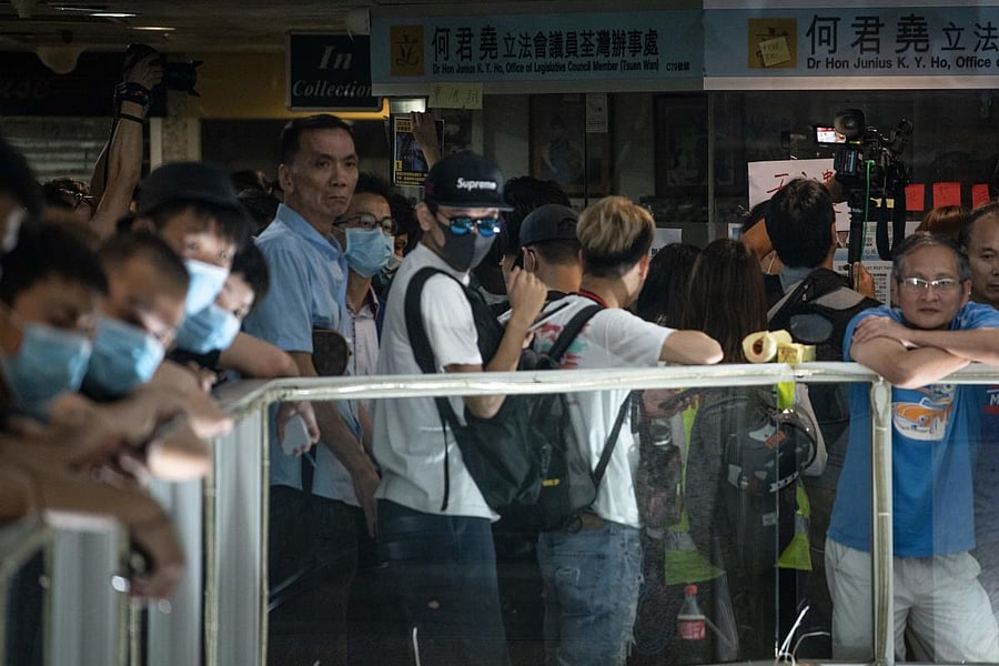 File photo of protesters gather outside the office of pro-Beijing government lawmaker Junius Ho in Hong Kong's Tsuen Wan district on July 22, 2019. Photo credit: AFP
