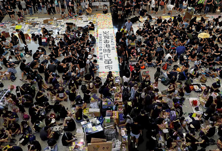 Anti-extradition bill demonstrators attend a protest at the arrival hall of Hong Kong Airport (Reuters photo)