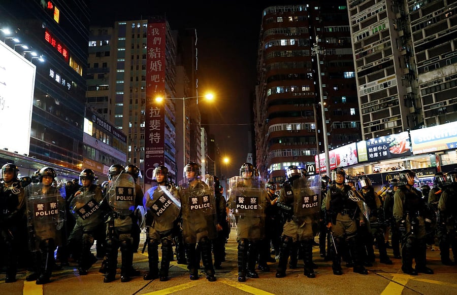 Riot police officers are seen near Mong Kok police station in Hong Kong. (Reuters Photo)