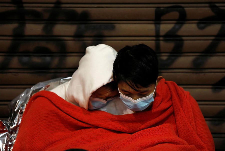 Protesters sits inside the Hong Kong Polytechnic University campus while waiting for medical attention during protests in Hong Kong, China, November 19, 2019. REUTERS/Adnan Abidi