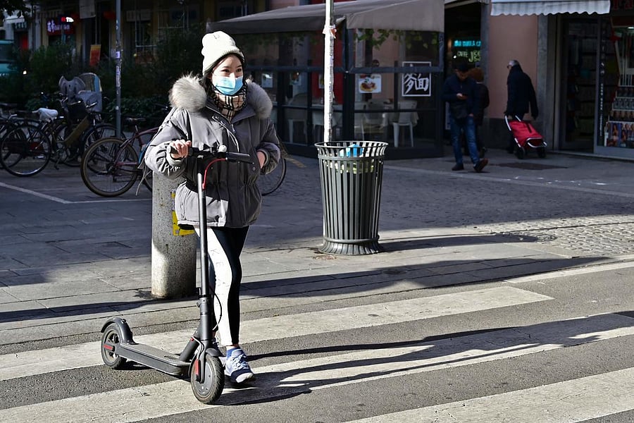 A woman in Via Paolo Sarpi, a street in Milan, Italy, known to be the center of the city's Chinese community. Several well-known figures in the Chinese community in Italy have denounced "discrimination without distinction."