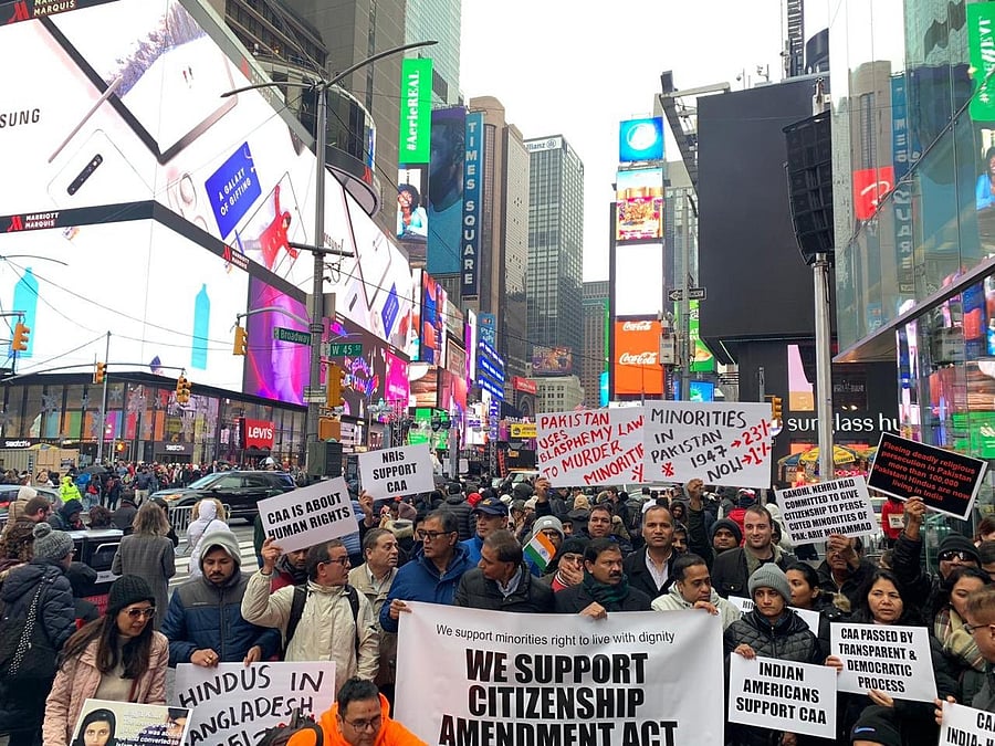 A group of Indian-Americans gathered at Times Square on Sunday, carrying placards and raising slogans in support of the Narendra Modi government and CAA. Photo/Twitter (@ThakurRanjitDas)