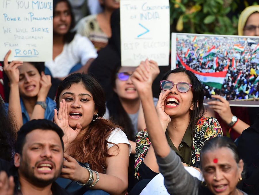 Protestors display placards and raise slogans during a protest against the Citizenship Amendment Act (CAA), National Register of Citizenship (NRC) and National Population Register(NPR) in Bengaluru. PTI