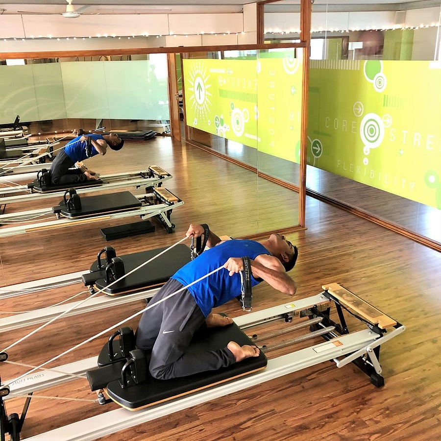 A back extension further challenged by adding upper body resistance.