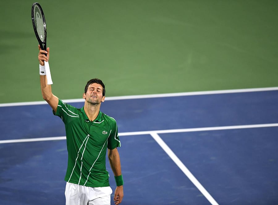 Serbia's Novak Djokovic celebrates after defeating to Tunisia's Malek Jaziri during round 1 of the Dubai Duty Free Tennis Championships in the United Arab Emirates. AFP