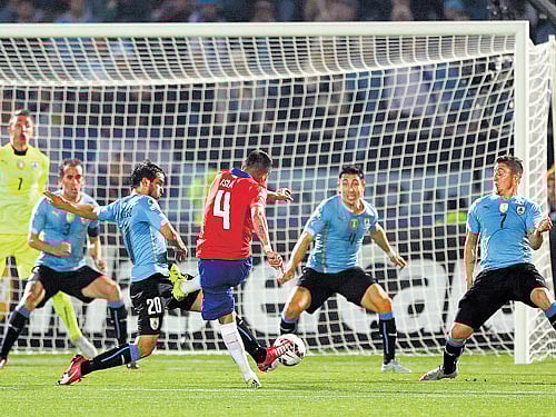 killer blow: Chile's Mauricio Isla scores the winner during their quarterfinal against Uruguay. AP