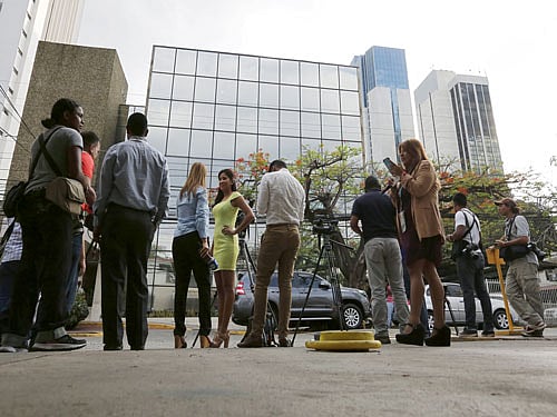 Organised crime police surrounded Mossack Fonseca's headquarters in Panama City yesterday as the offices were being searched, along with several other branches. Reuters Photo.