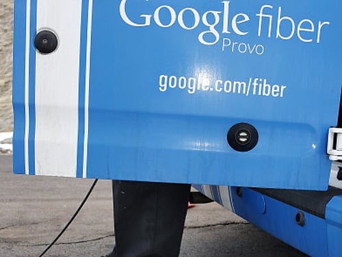 A technician gets cabling out of his truck to install Google Fiber in a residential home in Provo, Utah, January 2, 2014. Provo is one of three cities Google is currently building and installing gigabit internet and television service for business and residential use.  Reuters.