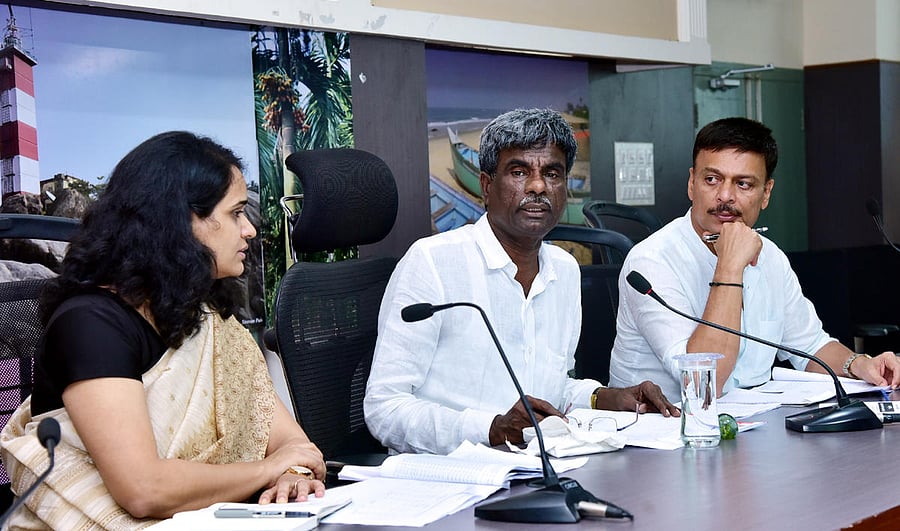 Minister for Ports, Fisheries and Inland Transport Kota Srinivas Poojary speaks at a review meeting in Mangaluru on Monday. DH Photo