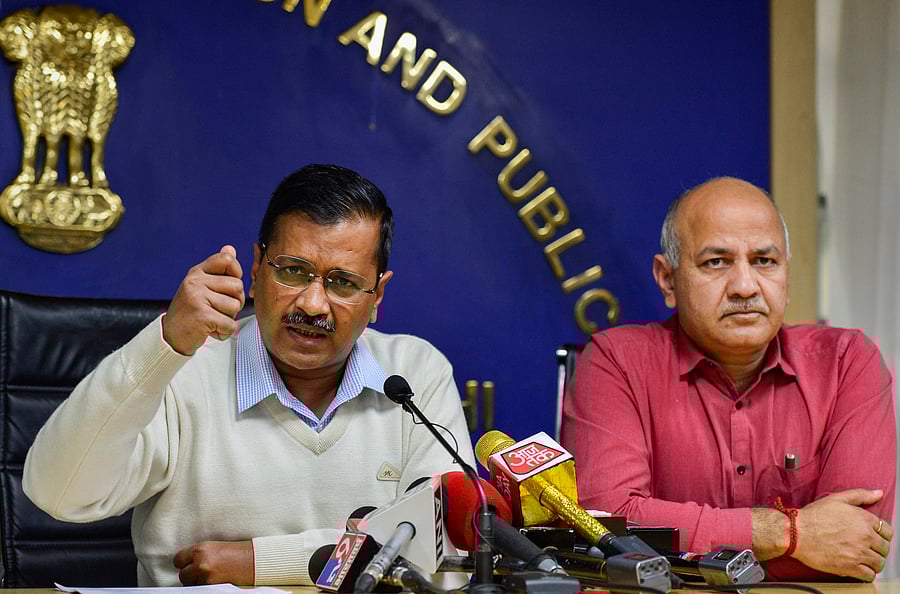 Delhi Chief Minister Arvind Kejriwal addresses a press conference as Deputy Chief Minister Manish Sisodia. (PTI Photo)