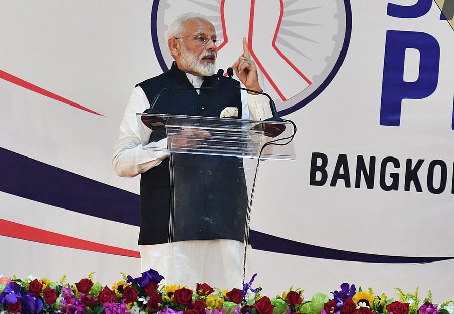 Prime Minister Narendra Modi gestures while addressing the crowd during the 'Sawasdee PM Modi’ event in Bangkok. (PTI Photo)