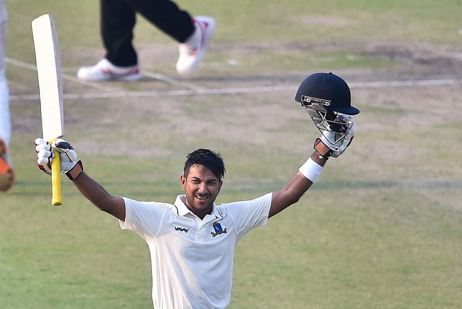 Bengal batsman Anustup Majumdar celebrates after scoring a century against Karnataka during the Ranji Trophy semifinal at Eden Garden on Saturday. PTI