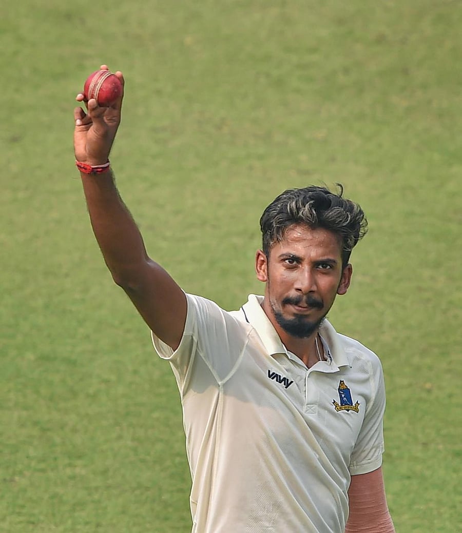 Ishan Porel celebrates after picking up five wickets against Karnataka. PTI
