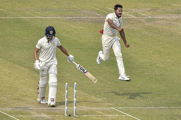 Bengal bowler Mukesh Kumar (R) reacts after dismissing Karnataka batsman Manish Pandey (L) during 2nd day of Ranji Trophy semifinal match at Eden Garden in Kolkata, Sunday, March 1, 2020. (PTI Photo/Swapan Mahapatra)