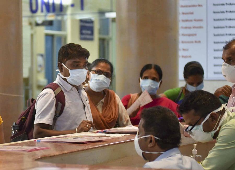 Visitors wear protective masks in wake of the deadly novel coronavirus, at Government Gandhi Hospital in Hyderabad. (PTI Photo)