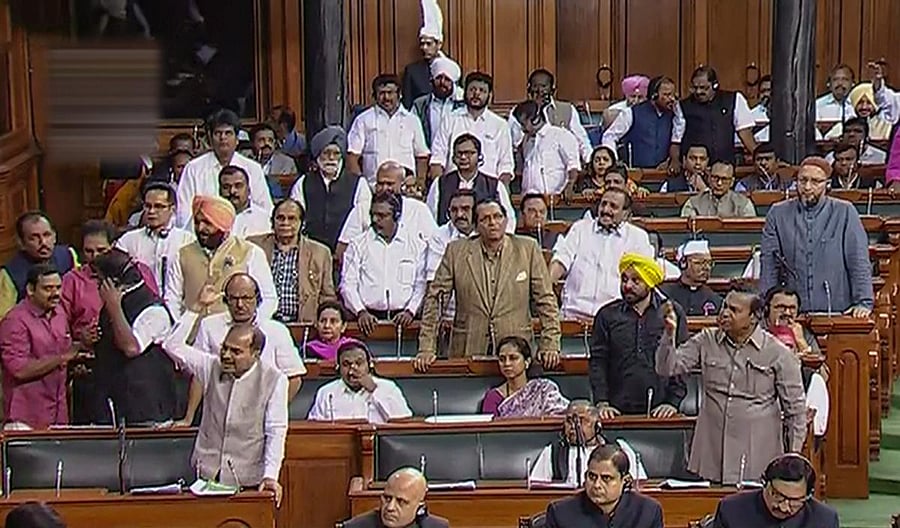 Opposition members protest in the Lok Sabha (PTI Photo)