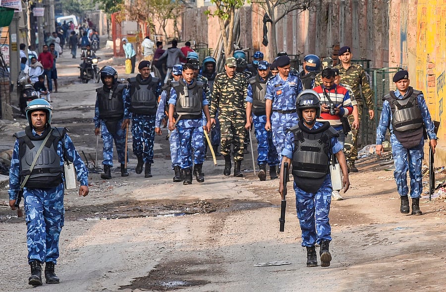 Security personnel patrol a violence-affected area of Northeast Delhi. (PTI Photo)