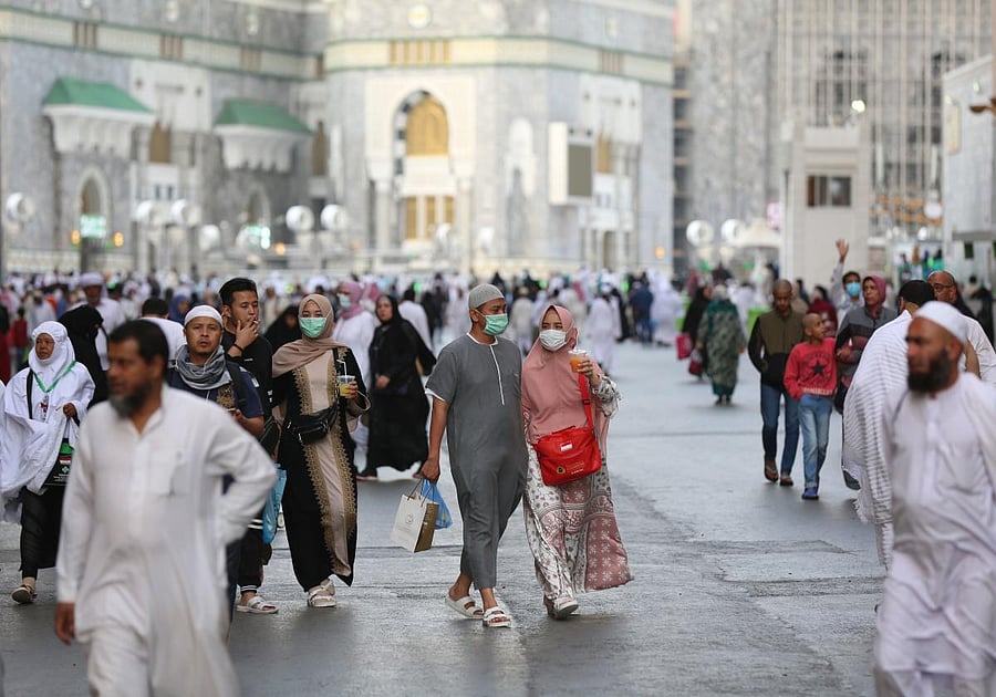 Muslim pilgrims wear masks at the Grand Mosque in Saudi Arabia's holy city of Mecca on February 28, 2020. Credit: AFP Photo