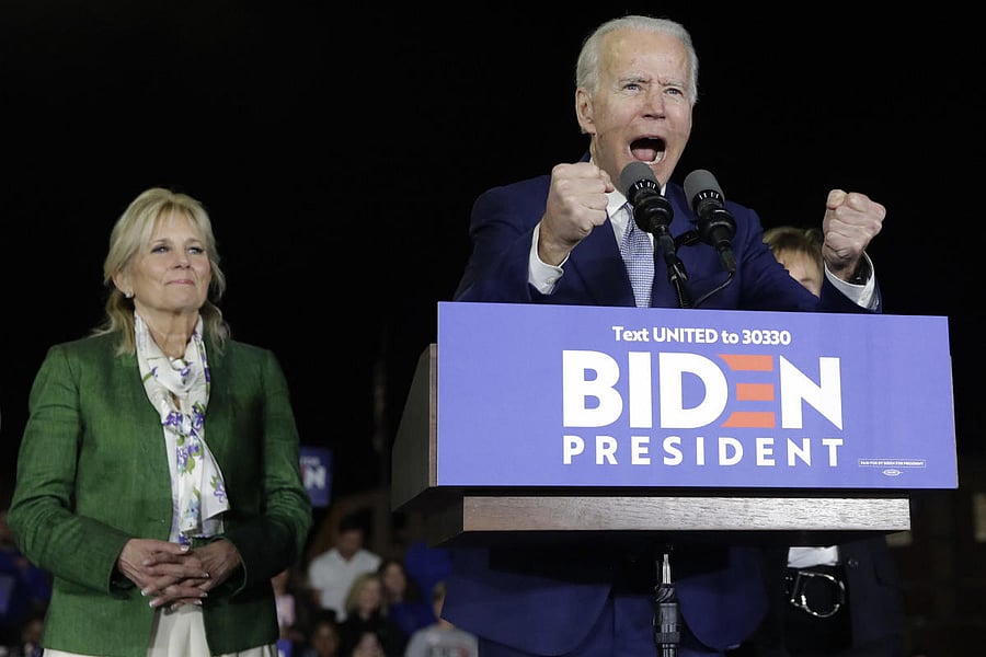  Democratic presidential candidate former Vice President Joe Biden, accompanied by his wife Jill, gestures as he speaks during a primary election night rally Tuesday, March 3, 2020, in Los Angeles. AP/PTI