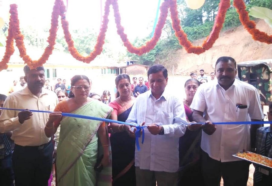 MLA K G Bopaiah inaugurated the new building of Government Higher Primary School in Jodupala in Madikeri taluk on Saturday.(Below) Students take partin the programme. DH Photos
