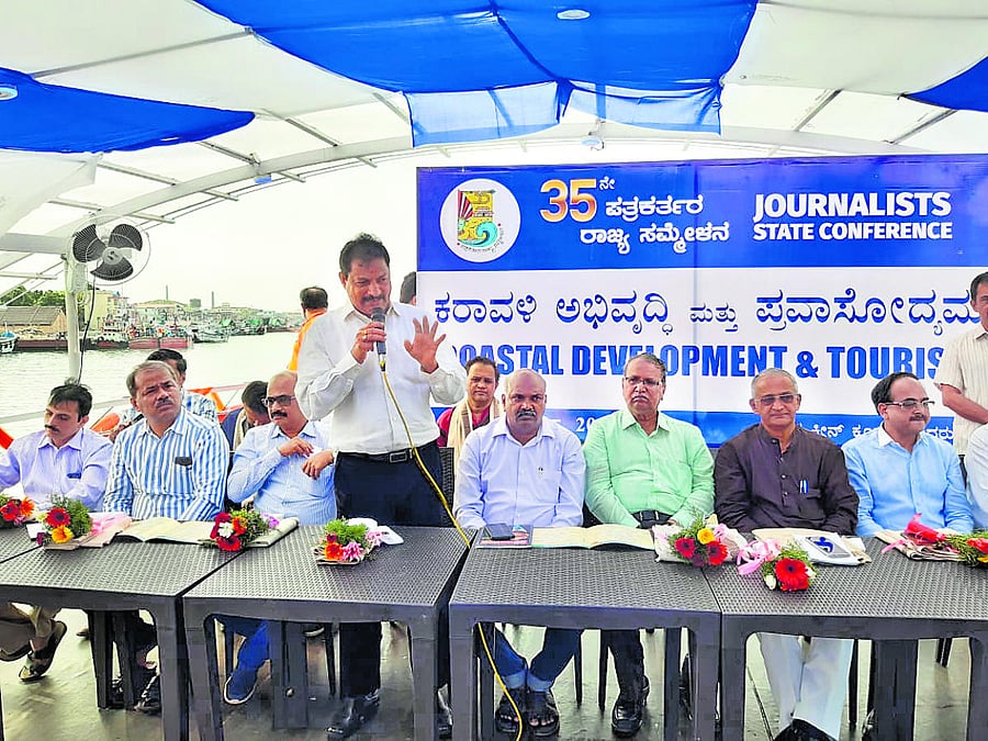 Coastal Development Authority Chairman Mattaru Ratnakar Hegde speaks during the inauguration of unique seminar on 'Coastal Development and Tourism', on board the Cruise boat 'Rani Abbakka' on Sunday. Well-known writer Prof B A Viveka Rai and former MLC Ca