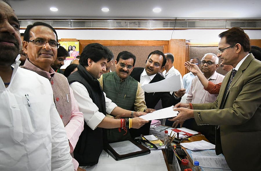 JP leader Jyotiraditya Scindia files his nomination papers to Returning Officer AP Singh for Rajya Sabha elections, at Madhya Pradesh Assembly in Bhopal,(PTI Photo)