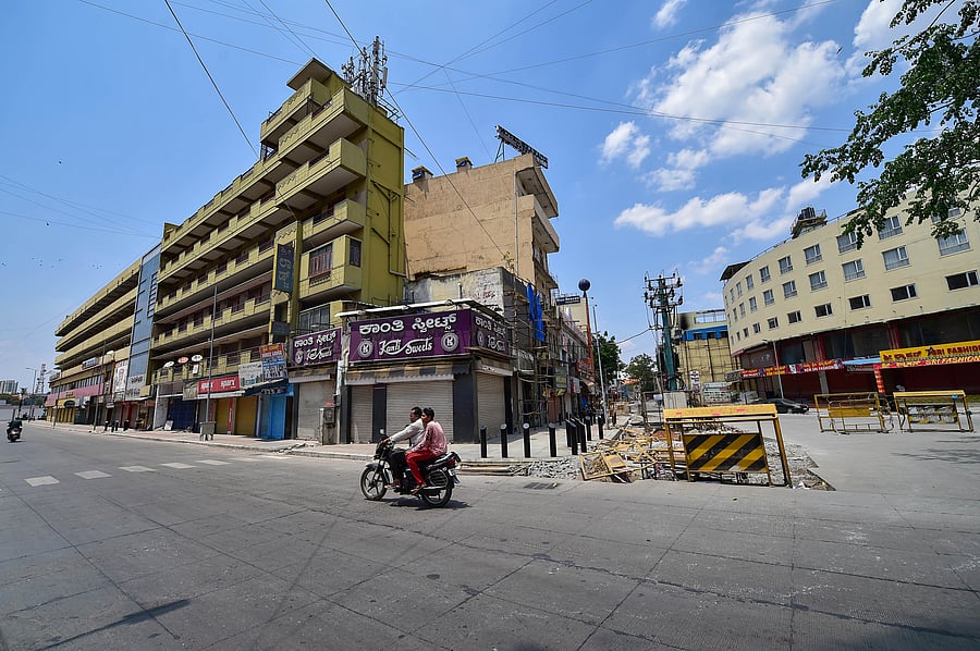 A city street wears a deserted look during 'Janta curfew' in the wake of coronavirus pandemic, in Bengaluru. (PTI Photo)