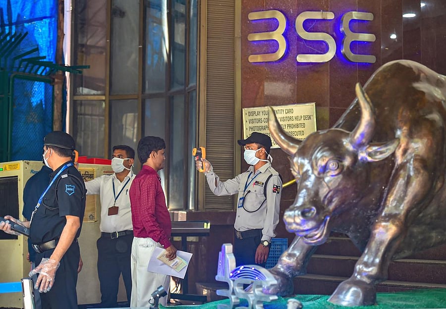: Security personnel use thermal screening devices on visitors to mitigate the coronavirus pandemic, at BSE Building (PTI Photo)