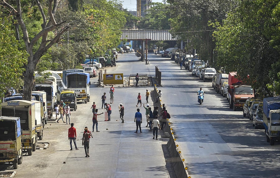 : Children play cricket on an empty street during 'Janta curfew' in the wake of coronavirus pandemic in Mumbai(PTI Photo)