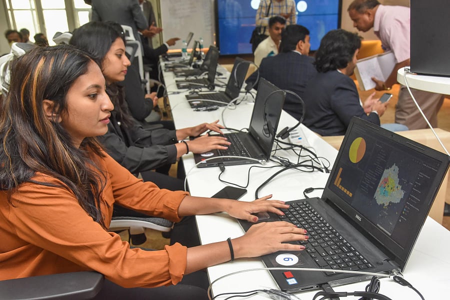 People work at BBMP's war room for monitoring coronavirus cases in Bengaluru on Monday. DH Photo/S K Dinesh