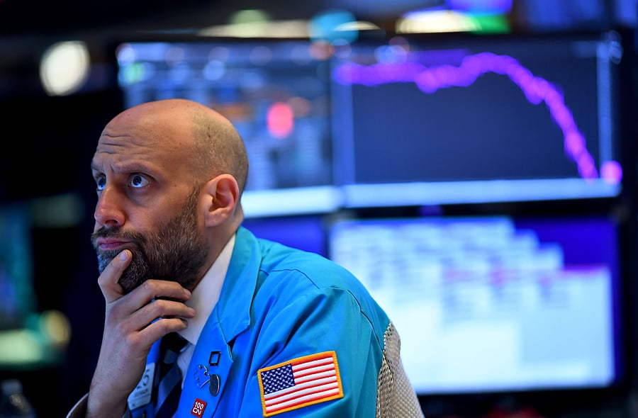  In this file photo traders work during the opening bell at the New York Stock Exchange (NYSE) on March 19, 2020, at Wall Street in New York City. (Credit: AFP Photo)