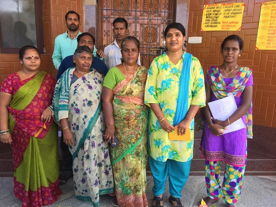 he woman being reunited with her family. Members of the family and officials of SCRB are seen. DH Photo