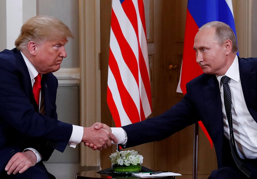 U.S. President Donald Trump and Russia's President Vladimir Putin shake hands as they meet in Helsinki, Finland July 16, 2018. Credit: Reuters Photo
