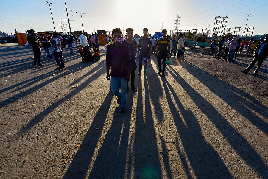 Migrants walk to their native villages amid the nationwide lockdown in the wake of coronavirus pandemic/ Representative photo. (Credit: PTI)